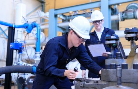 Person working at machine with overseer